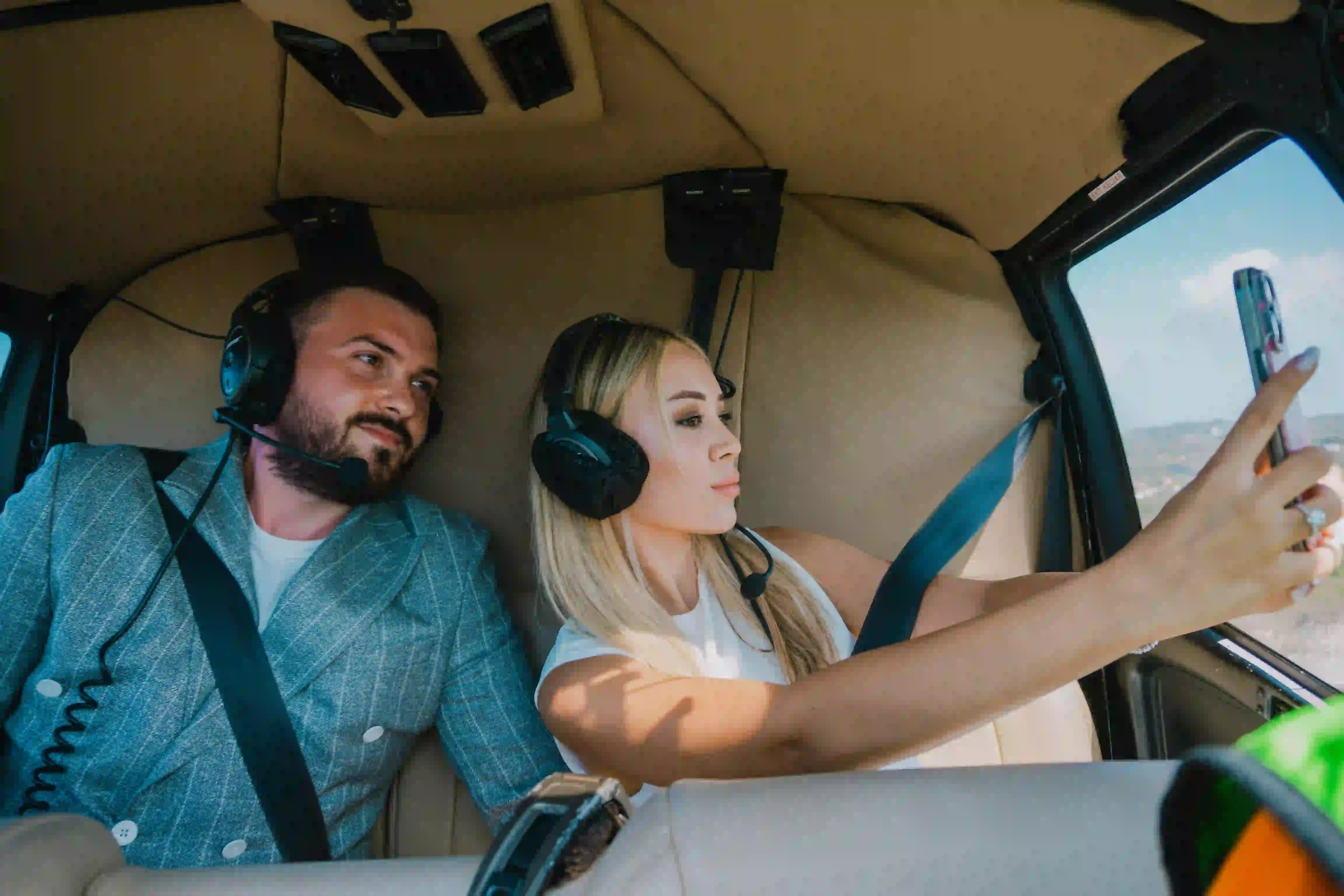 Couple enjoying helicopter tour in Bali